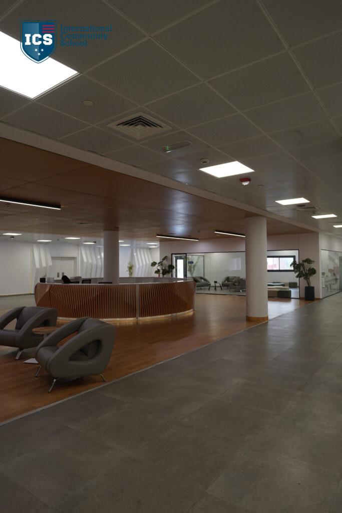 INTERNATIONAL COMMUNITY SCHOOL — Execution 5