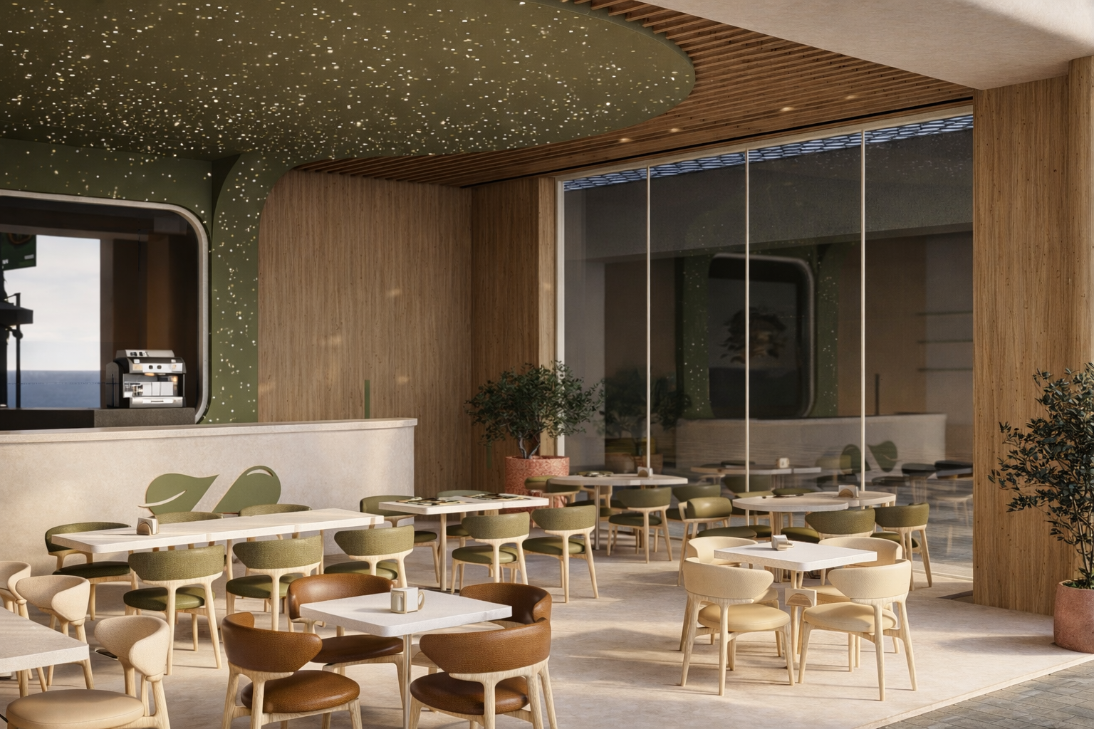 Curved service counter with sculpted leaf logo and glass wall opening to the terrace