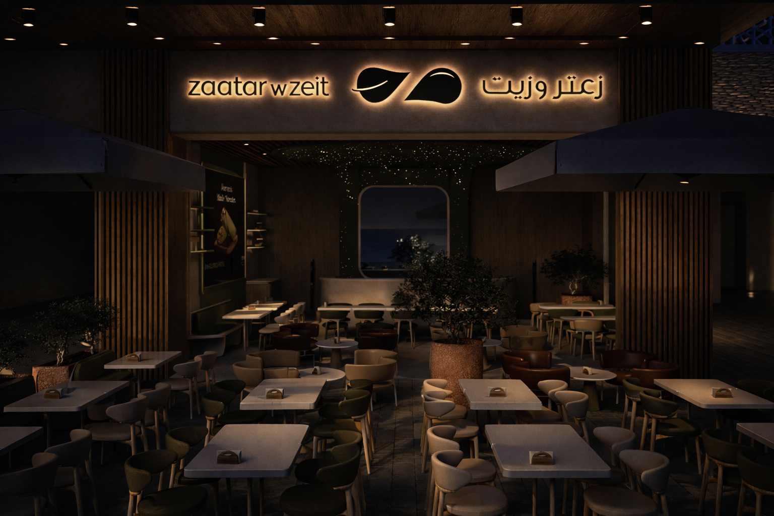 Zaatar w Zeit Kuwait storefront at night with softly glowing signage