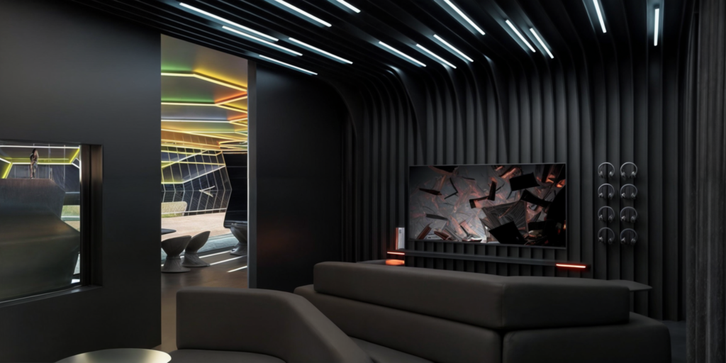 Dark gaming room with deep sofas